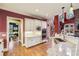 Well-equipped kitchen boasts stainless appliances, granite countertops, custom cabinetry, and hardwood flooring at 963 Manor Parc Dr, Decatur, GA 30033