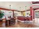 Open-concept kitchen and dining area with white cabinetry, granite counters, and hardwood floors at 963 Manor Parc Dr, Decatur, GA 30033