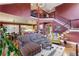 Open-concept living room with a staircase, hardwood floors, and a view into the kitchen and dining area at 963 Manor Parc Dr, Decatur, GA 30033