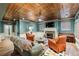 Open-concept living room with a fireplace, piano, and cozy seating at 963 Manor Parc Dr, Decatur, GA 30033