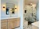 This primary bath features a marble shower, double vanity with gold hardware, and modern fixtures at 1122 Manning Farms Ct, Atlanta, GA 30338