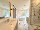 Luxurious primary bathroom with soaking tub, marble shower, and stylish fixtures at 1122 Manning Farms Ct, Atlanta, GA 30338