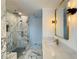 Spacious bathroom featuring marble floors, double vanity and large glass shower with marble surround at 1122 Manning Farms Ct, Atlanta, GA 30338