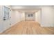 A spacious living room featuring vinyl floors, white walls, and natural light from the windows at 1122 Manning Farms Ct, Atlanta, GA 30338