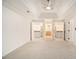Spacious main bedroom with a tray ceiling, ceiling fan, and access to closets and bathroom at 1122 Manning Farms Ct, Atlanta, GA 30338