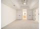 Large main bedroom boasts a tray ceiling with ceiling fan, and doorways to closets and bathroom at 1122 Manning Farms Ct, Atlanta, GA 30338