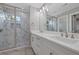 Modern bathroom with double sinks, marble counters and large glass enclosed shower at 1857 Derrill Dr, Decatur, GA 30032