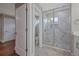 Bathroom with a stone and glass walk in shower, modern vanity, and grey tones at 1857 Derrill Dr, Decatur, GA 30032