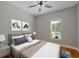 The main bedroom is furnished with hardwood floors, ceiling fan, and a large window at 1857 Derrill Dr, Decatur, GA 30032