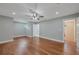 Spacious bedroom features hardwood floors, a ceiling fan, and an ensuite bathroom at 1857 Derrill Dr, Decatur, GA 30032