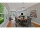 Dining area with wood table and chairs, views the modern living area and outside at 1857 Derrill Dr, Decatur, GA 30032