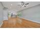 Open-concept living room featuring hardwood floors and access to the kitchen at 1857 Derrill Dr, Decatur, GA 30032