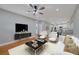 Bright living room with hardwood floors, ceiling fan, and modern furnishings at 1857 Derrill Dr, Decatur, GA 30032