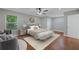 The main bedroom is furnished with a bed, chairs, and hardwood floors at 1857 Derrill Dr, Decatur, GA 30032