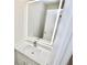 Bathroom with LED mirror, white sink and vanity with modern faucet and light countertops at 4579 Glenforest Ne Dr, Roswell, GA 30075