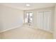 Bedroom featuring a window and a large closet with bifold doors at 4579 Glenforest Ne Dr, Roswell, GA 30075