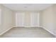 Bedroom featuring wood-look flooring and a large closet with bifold doors at 4579 Glenforest Ne Dr, Roswell, GA 30075
