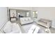 Bright living room with light gray walls, hardwood floors, and modern furniture at 4579 Glenforest Ne Dr, Roswell, GA 30075