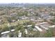 Aerial view of townhome community near highway and Atlanta skyline with trees at 115 Woodmere Nw Sq # 115, Atlanta, GA 30327
