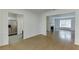 Inviting living room featuring hardwood floors and an open floor plan to the kitchen and fireplace at 115 Woodmere Nw Sq # 115, Atlanta, GA 30327
