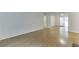 Bright and airy living room with hardwood floors and sliding doors leading to another living space at 115 Woodmere Nw Sq # 115, Atlanta, GA 30327
