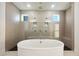 Stunning bathroom with a soaker tub and a large glass enclosed shower with bench at 1925 Harken Grv, Marietta, GA 30064