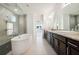 Bathroom features a large soaking tub, double vanity, and a glass-enclosed shower at 1925 Harken Grv, Marietta, GA 30064