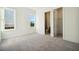 This bedroom features neutral carpeting, ample natural light, and an ensuite bath at 1925 Harken Grv, Marietta, GA 30064