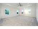 A bedroom with neutral carpet, white trim, a ceiling fan, and bright natural light at 1925 Harken Grv, Marietta, GA 30064