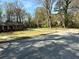 Quaint brick home with a lovely front yard and circular driveway for added convenience at 4063 Windsor Castle Way, Decatur, GA 30034