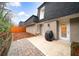 Private backyard with brick patio, new fence and access to the rear of the house at 5210 Chemin De Vie, Atlanta, GA 30342