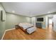 Well-lit bedroom with hardwood floors, closet, and attached bathroom at 5210 Chemin De Vie, Atlanta, GA 30342