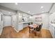 Elegant dining room with hardwood floors adjacent to kitchen, perfect for Gathering meals at 5210 Chemin De Vie, Atlanta, GA 30342