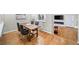 Comfortable dining room area with hardwood floors and a view of the fireplace at 5210 Chemin De Vie, Atlanta, GA 30342