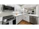 Bright and modern kitchen equipped with stainless steel appliances and stylish countertops at 5210 Chemin De Vie, Atlanta, GA 30342