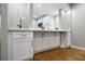 Open-concept kitchen featuring modern cabinets, granite countertops, and sleek hardware at 5210 Chemin De Vie, Atlanta, GA 30342