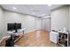 Well-lit home office features hardwood floors, a ceiling fan, and a modern desk setup at 5210 Chemin De Vie, Atlanta, GA 30342