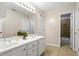 Bright bathroom featuring a double sink vanity, neutral walls, and a separate shower room at 5729 Brookstone Nw Walk, Acworth, GA 30101