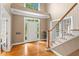 Welcoming foyer featuring hardwood floors and staircase bathed in natural light at 5729 Brookstone Nw Walk, Acworth, GA 30101