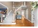Inviting foyer with hardwood floors, staircase, and view into adjacent rooms at 5729 Brookstone Nw Walk, Acworth, GA 30101