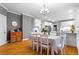 Eat-in kitchen with white cabinets, modern appliances, and a dining area, creating a cozy and functional space at 5729 Brookstone Nw Walk, Acworth, GA 30101