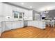 Bright kitchen boasts white cabinetry, granite countertops, and stainless steel appliances at 5729 Brookstone Nw Walk, Acworth, GA 30101