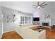 Bright living room features vaulted ceiling, fireplace, hardwood floors, and a large sectional sofa at 5729 Brookstone Nw Walk, Acworth, GA 30101