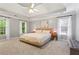 Spacious main bedroom features tray ceilings, a ceiling fan, and large windows to let in natural light at 5729 Brookstone Nw Walk, Acworth, GA 30101