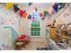 Charming playroom featuring colorful decor, a play kitchen, and a cozy table with chairs at 5729 Brookstone Nw Walk, Acworth, GA 30101
