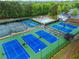 A birds-eye view of the community tennis courts with a gazebo and green landscaping at 5729 Brookstone Nw Walk, Acworth, GA 30101