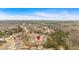 Aerial shot of a neighborhood surrounded by lush greenery highlights the tranquil setting and picturesque surroundings of the community at 114 Montgomery Ln, Villa Rica, GA 30180