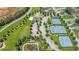 A bird's eye view of a community featuring tennis courts, parks, landscaped gardens, and green spaces at 114 Montgomery Ln, Villa Rica, GA 30180