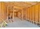 Unfinished basement with exposed framing, concrete floor, and ladder at 114 Montgomery Ln, Villa Rica, GA 30180