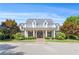 Beautiful clubhouse exterior with inviting front porch, manicured landscaping, and ample parking at 114 Montgomery Ln, Villa Rica, GA 30180